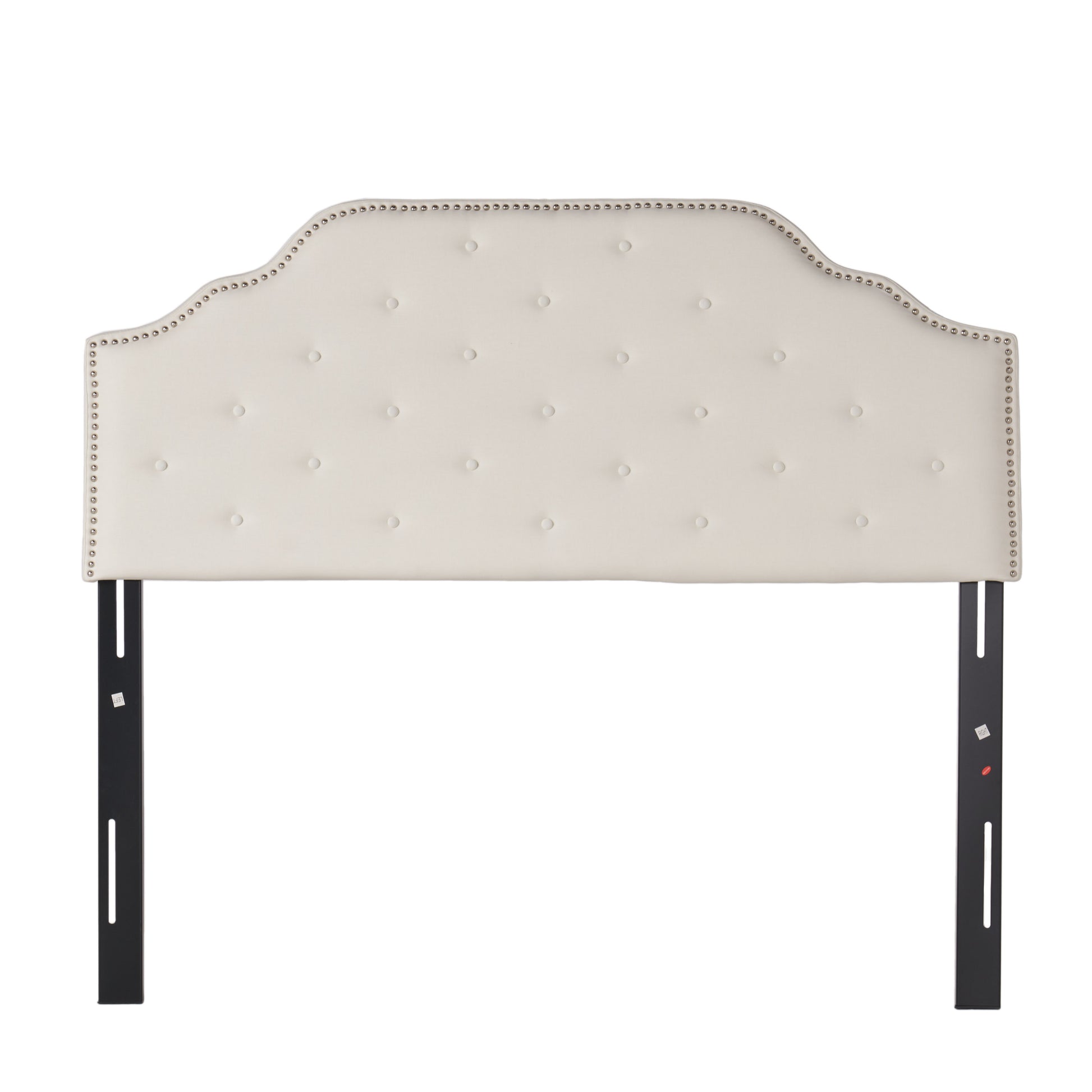 Tufted ivory upholstered headboard with nailhead trim and attached black metal bed frame legs