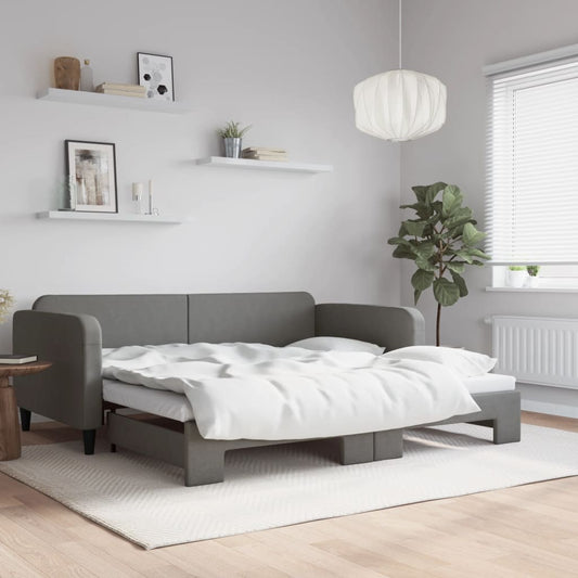 Gray fabric sofa bed with white bedding a versatile living room furniture piece