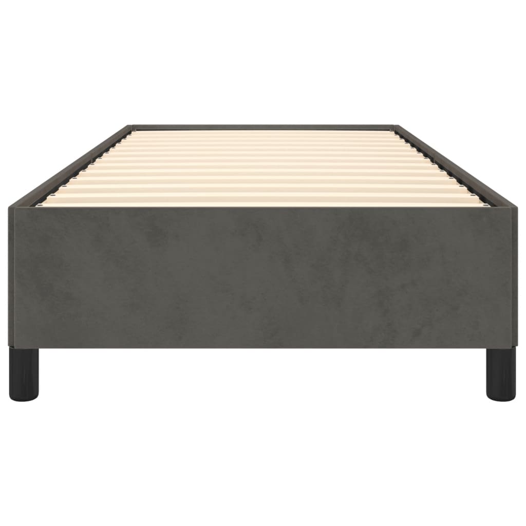 Dark gray upholstered single bed frame with a white mattress