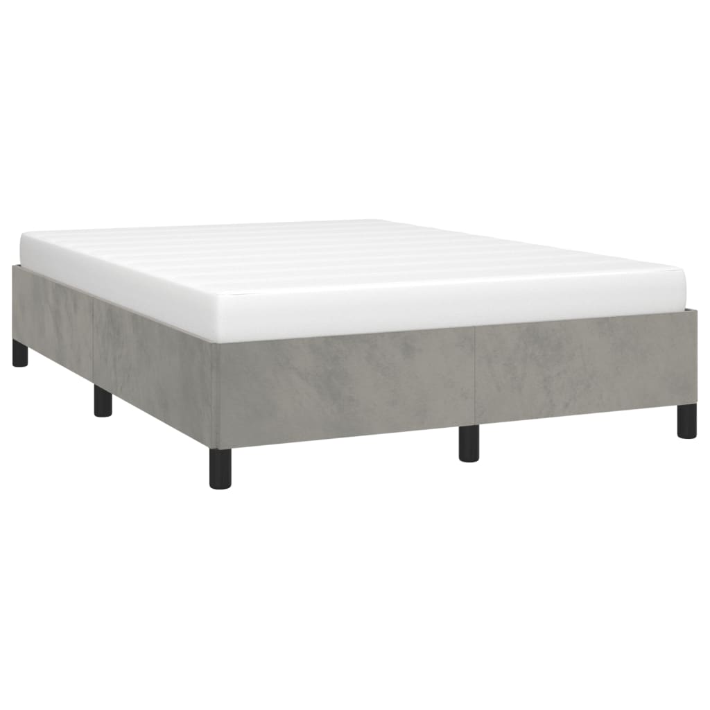 Modern grey concrete effect bed frame with a white mattress on black legs