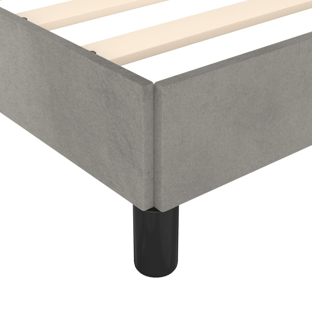 Gray upholstered platform bed frame with wooden slats