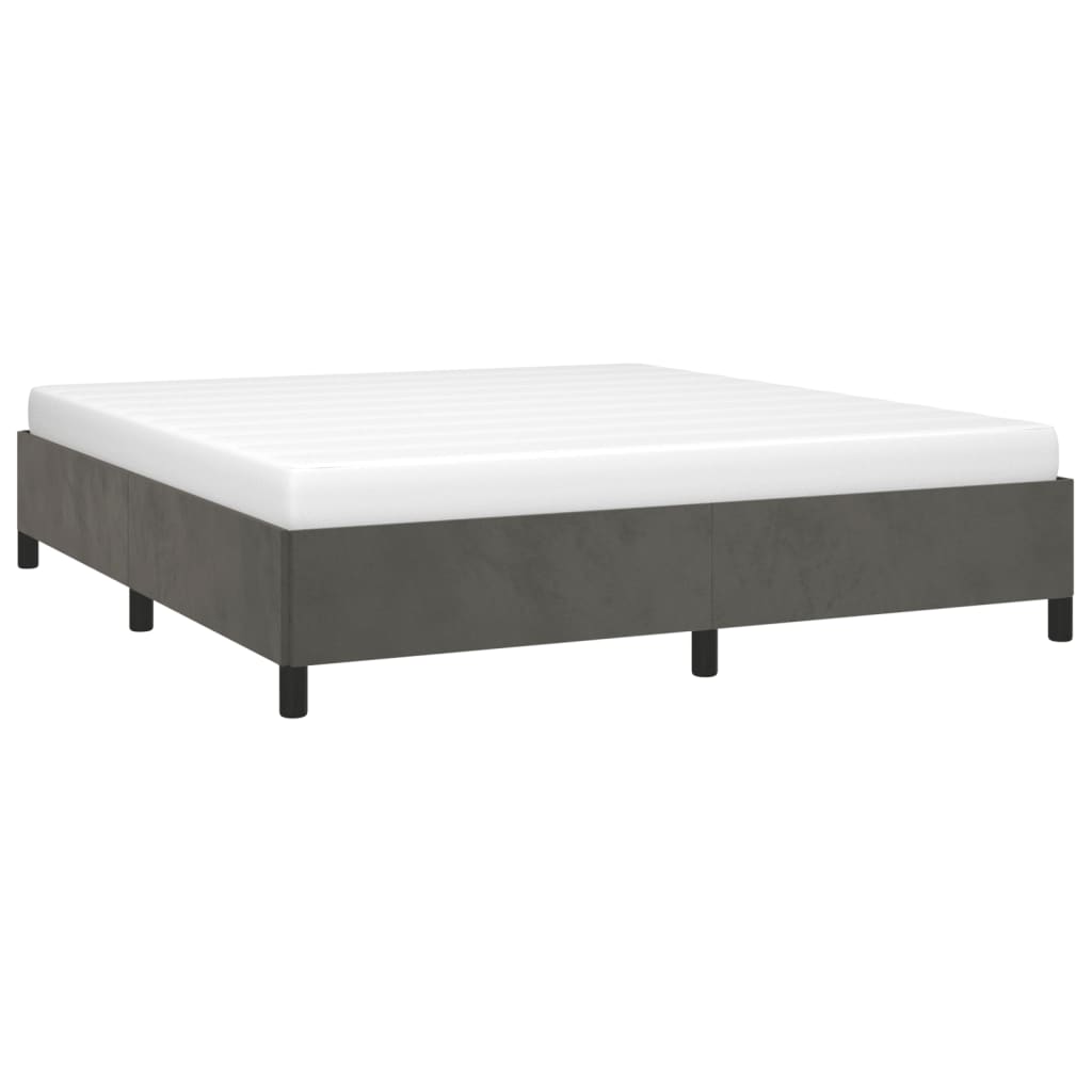 Grey upholstered bed frame with white mattress on black legs