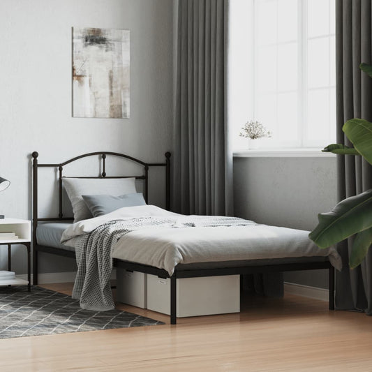 Black metal twin bed frame with arched headboard and footboard