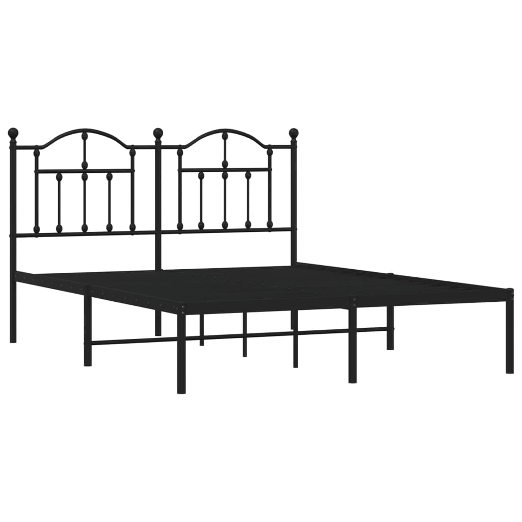 Black metal bed frame with decorative arched headboard and white mattress