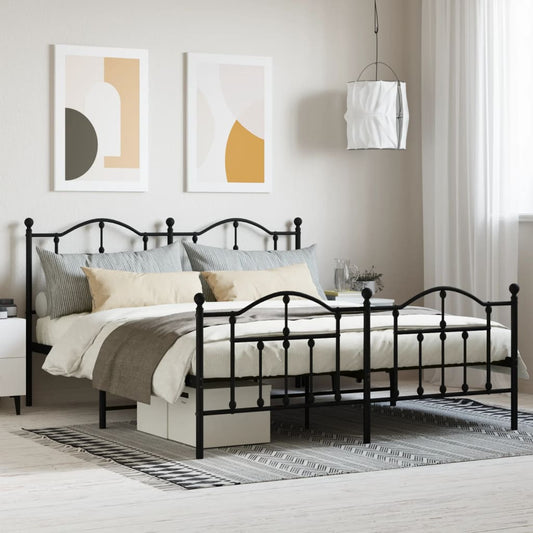 Black metal queen bed frame with ornate scrollwork headboard and footboard