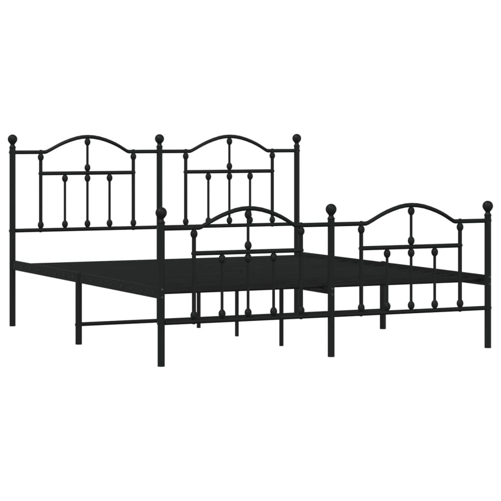 Black wrought iron bed frame with ornate detailing and white mattress