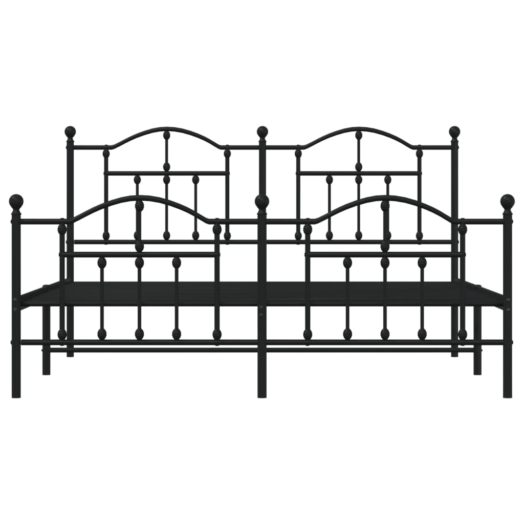 Black metal bed frame with ornate headboard and footboard featuring decorative finials and a patterned duvet