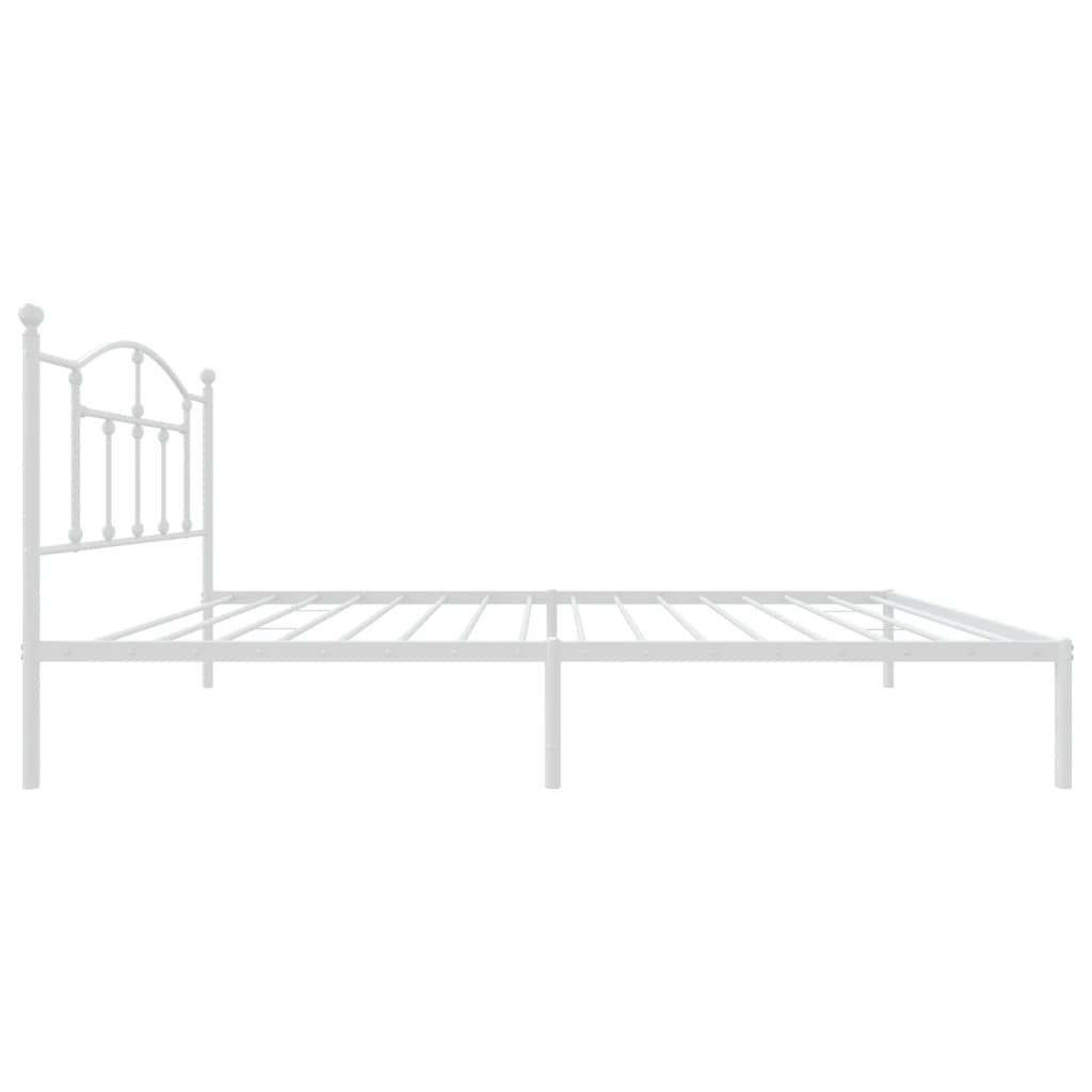 White metal bed frame with arched headboard and mattress