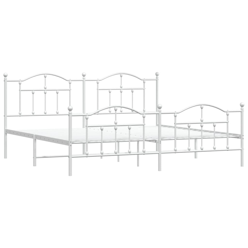 White metal bed frame with decorative finials and a mattress