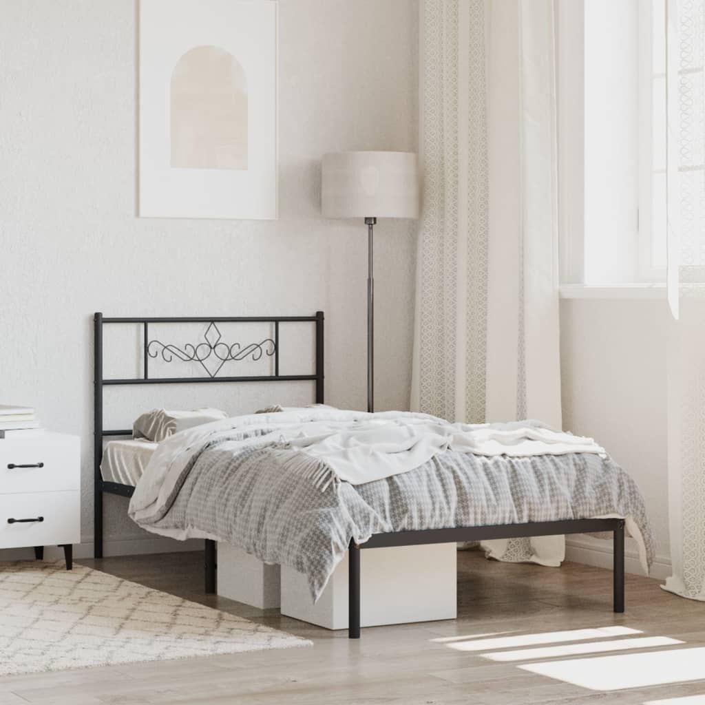 Black metal twin bed frame with ornate headboard and storage drawers under the mattress