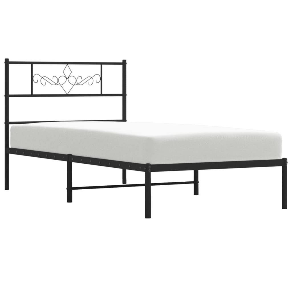 Black metal bed frame with ornate headboard detail