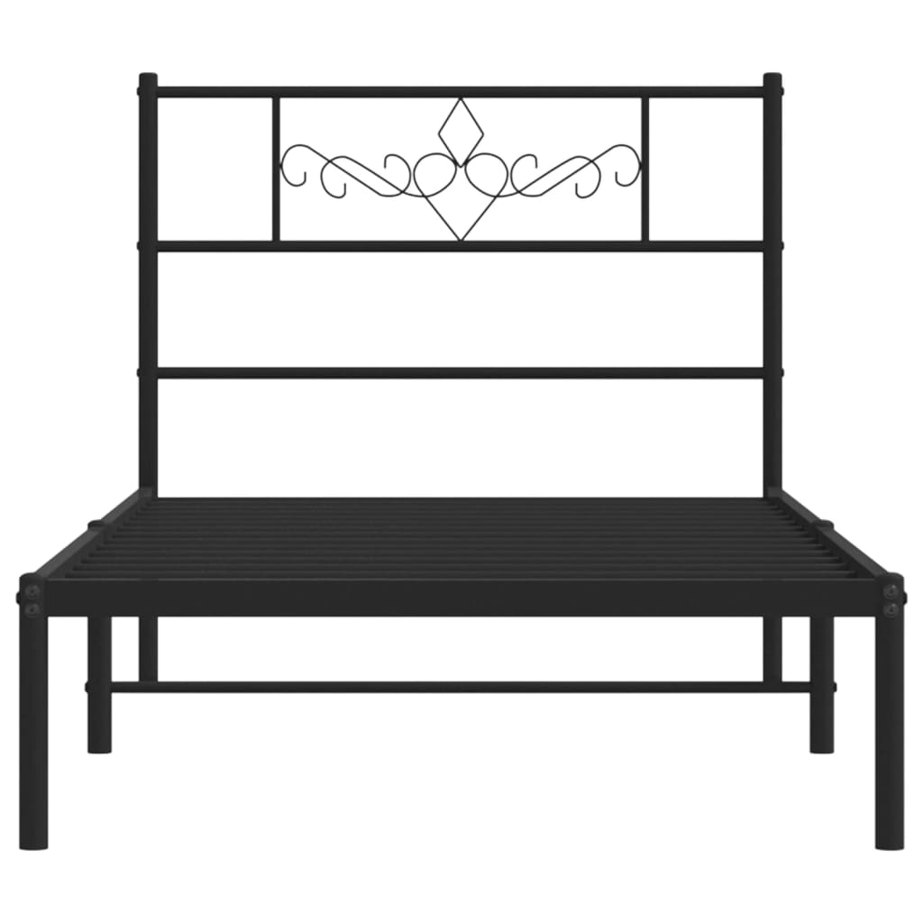 Black metal twin bed frame with ornate headboard detail
