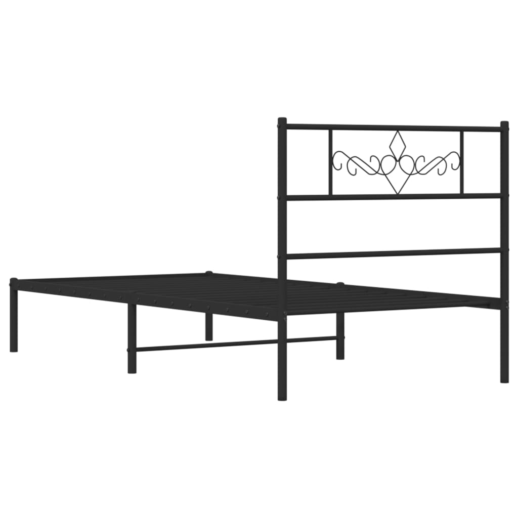Black metal bed frame with decorative headboard scrollwork and a slatted mattress support