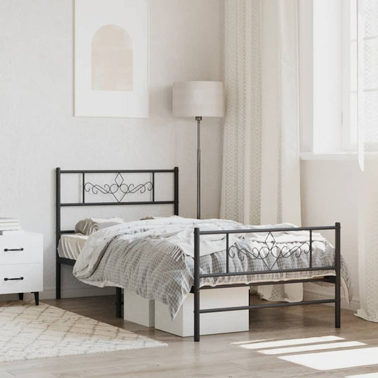 Black metal twin bed frame with decorative scrollwork headboard and footboard