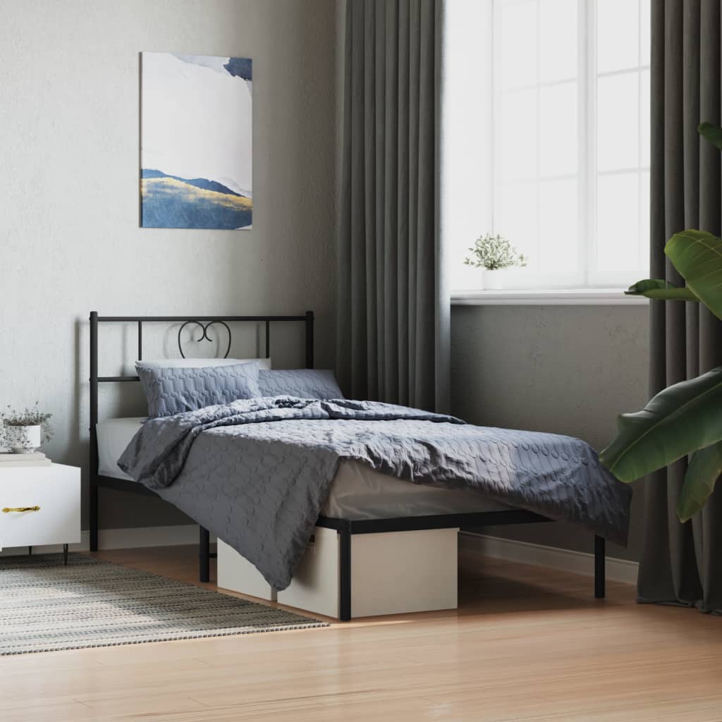 Black metal twin bed frame with heartshaped headboard detail
