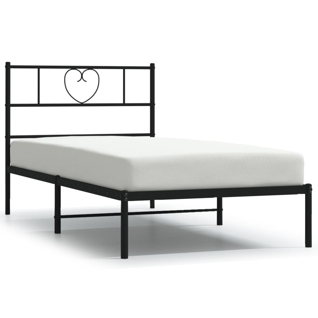 Line drawing of a white metal twin bed frame with a heartshaped headboard and side dimensions