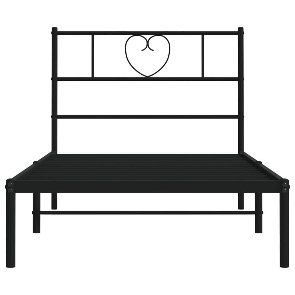 Black metal twin bed frame with heart detail on headboard