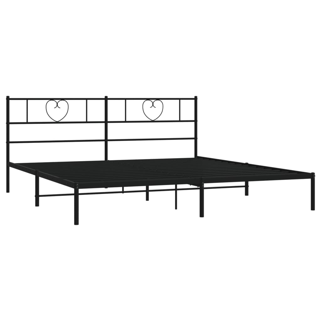 Black metal bed frame with heartshaped headboard and white mattress