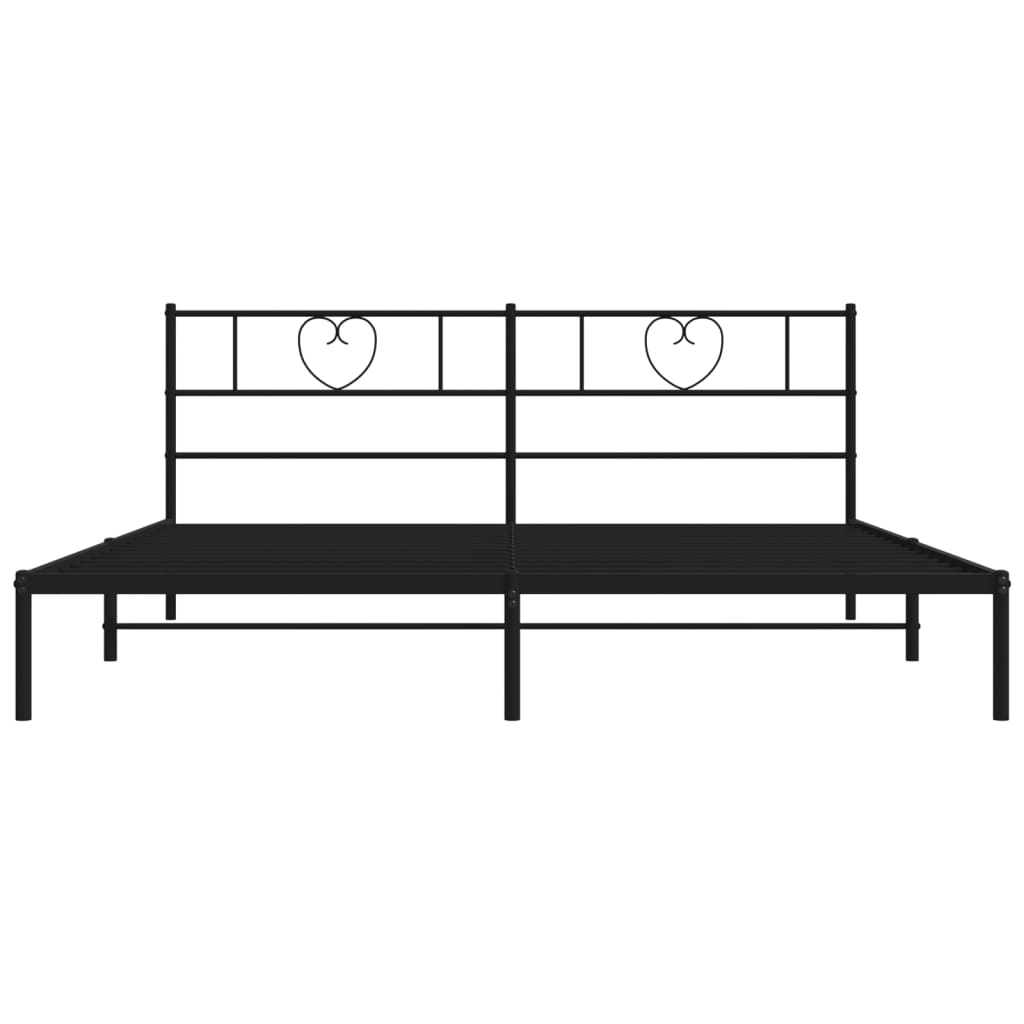 Metal bed frame with heart headboard details in a minimalist bedroom