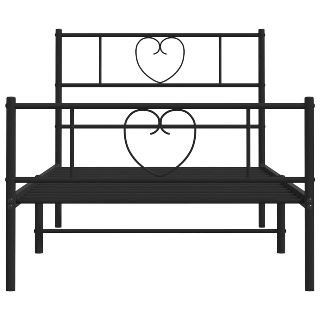 Black metal twin bed frame with heart detail on headboard