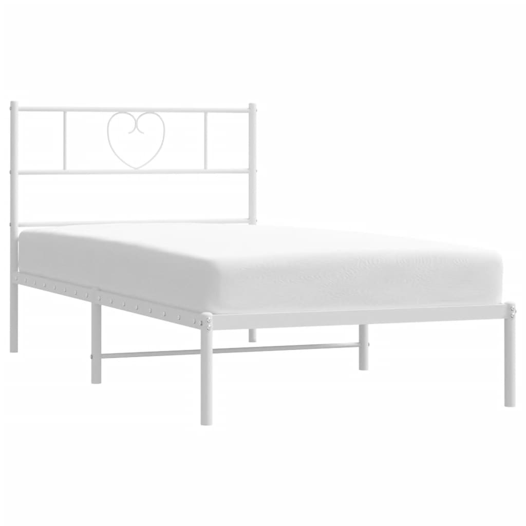 White metal twin bed frame with heartshaped headboard detail