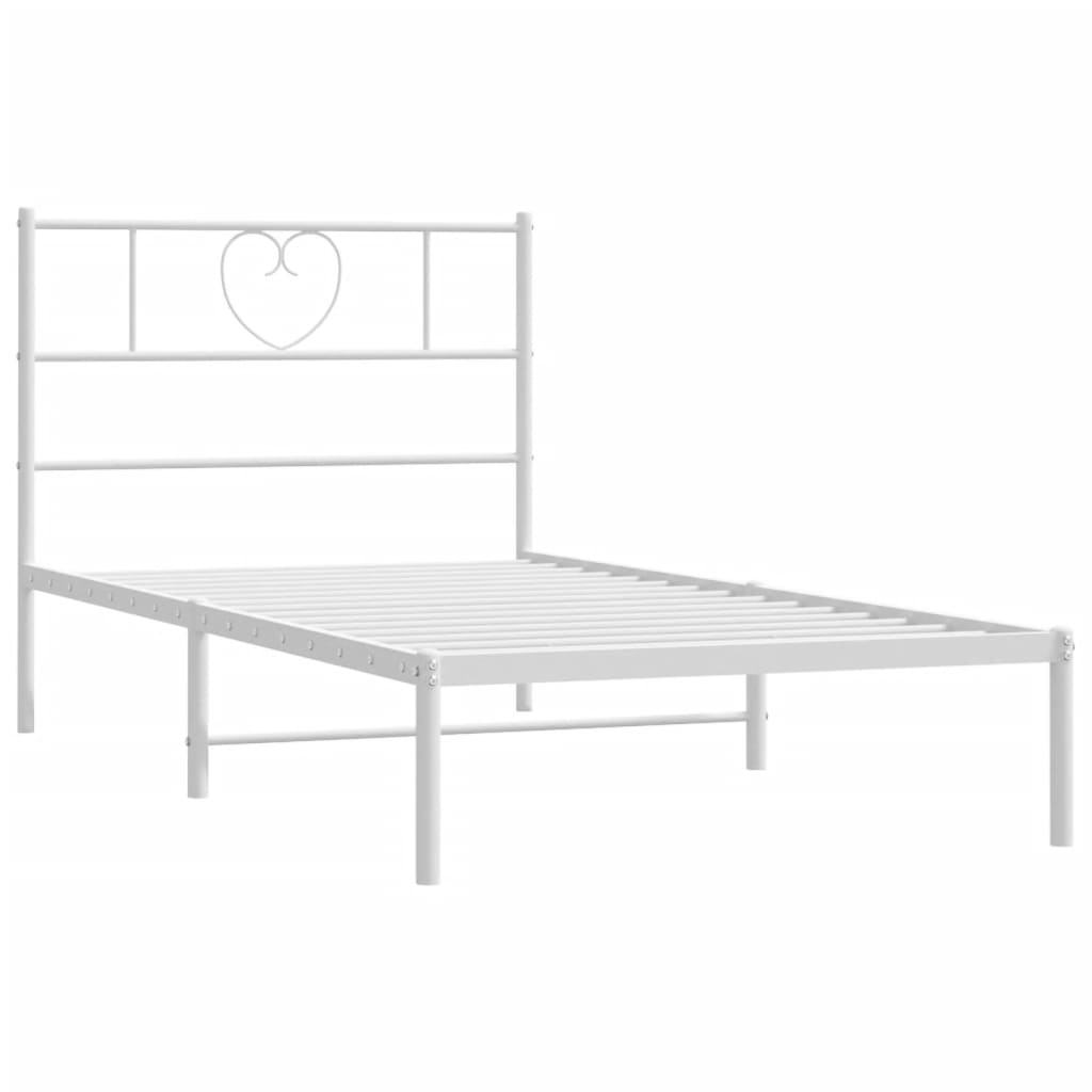 White metal twin bed frame with heart detail headboard