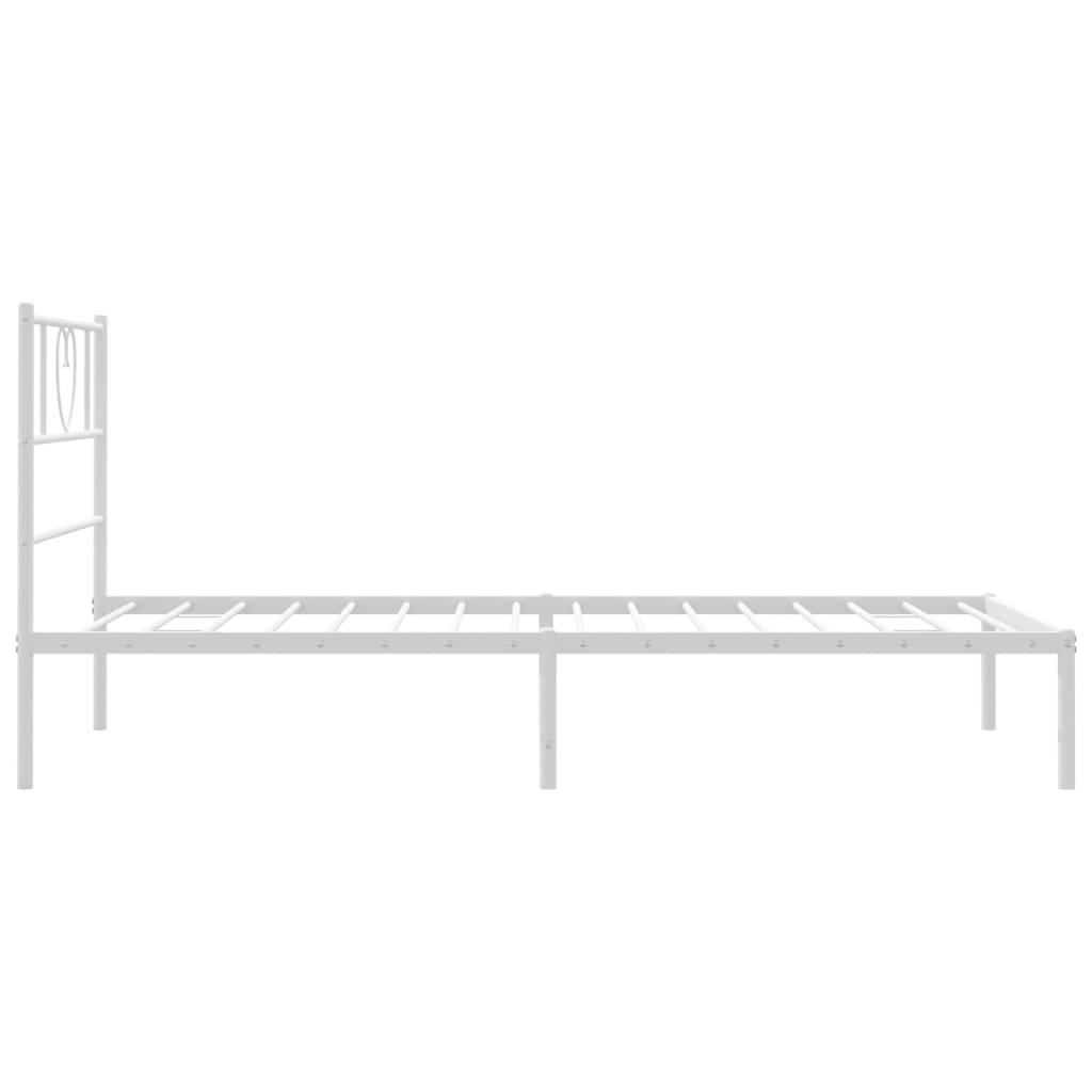 White metal twin bed frame with heart headboard detail