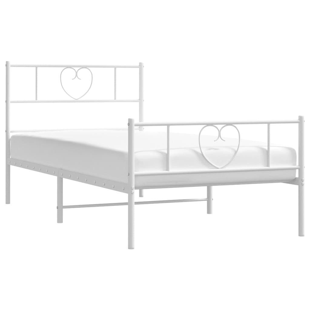 White metal twin bed frame with heart headboard detail