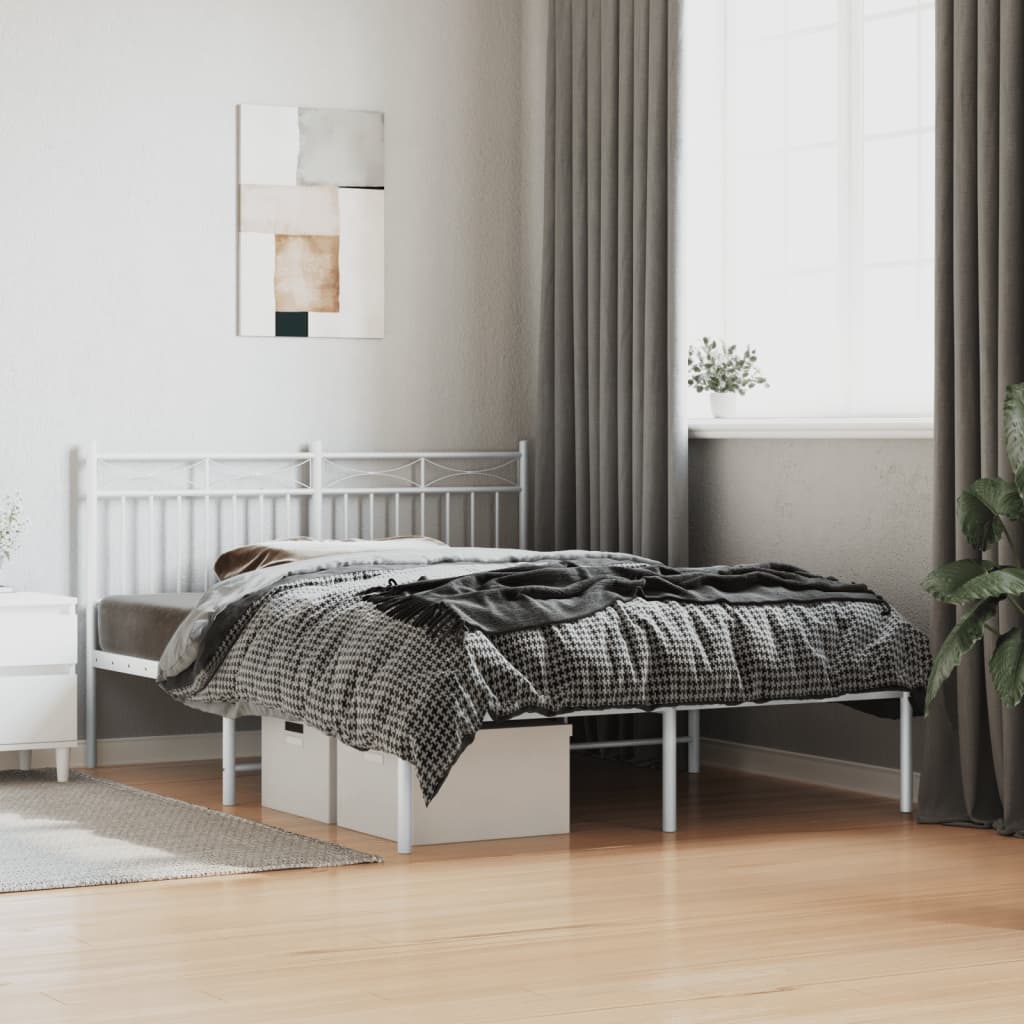 White metal platform bed frame with decorative headboard detail