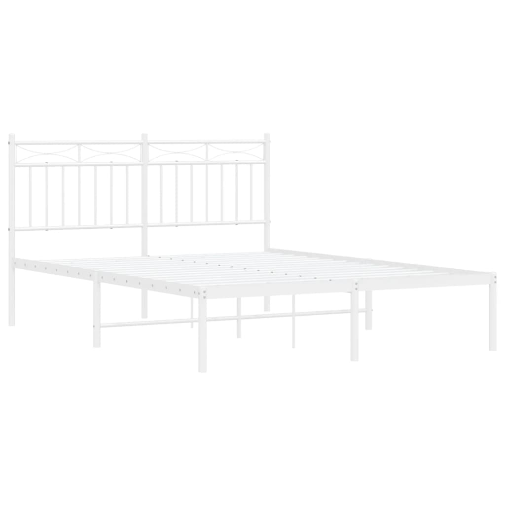 White metal bed frame with a decorative headboard and two pillows