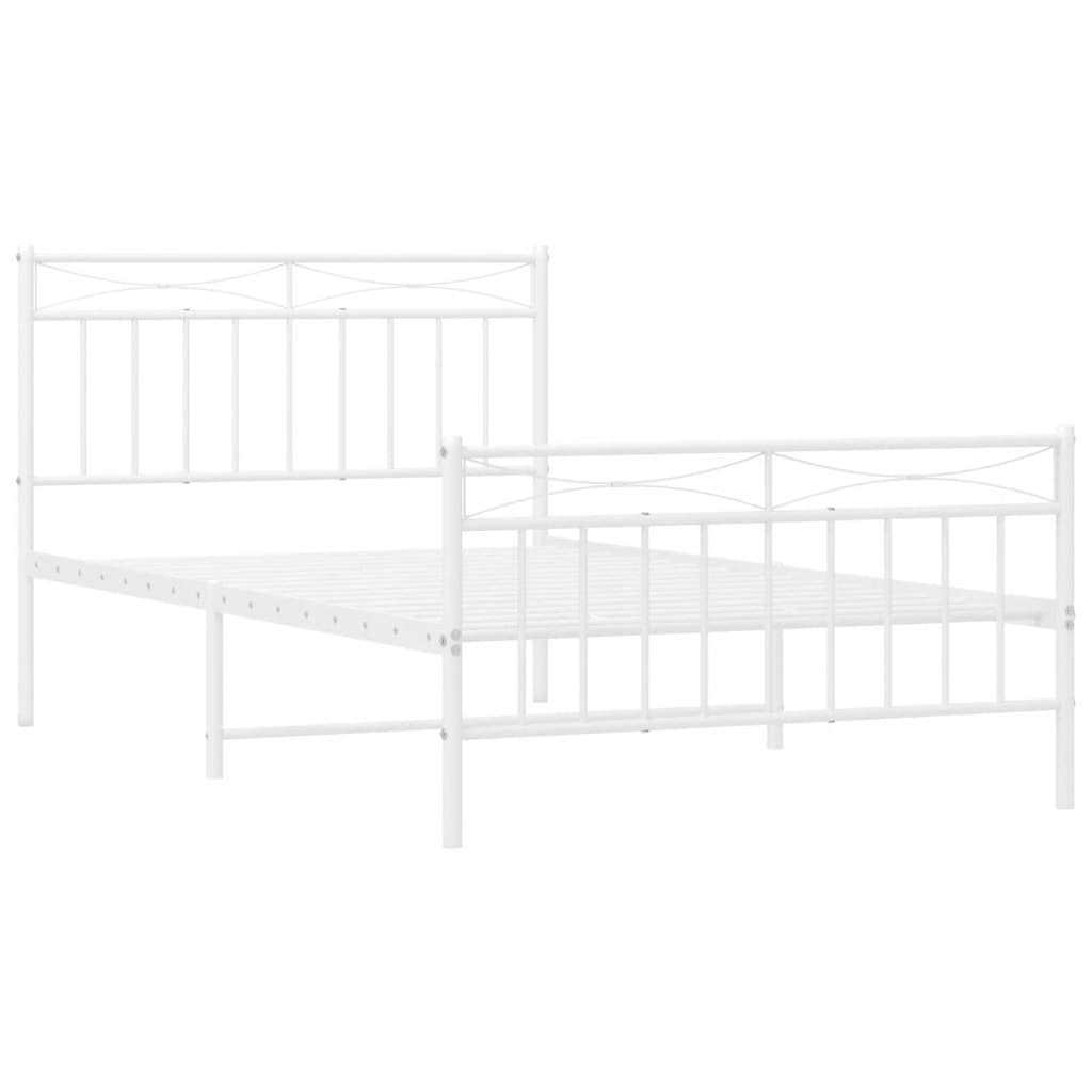 White metal bed frame with a minimalist design and ornate headboard featuring a simple mattress and a cozy blanket