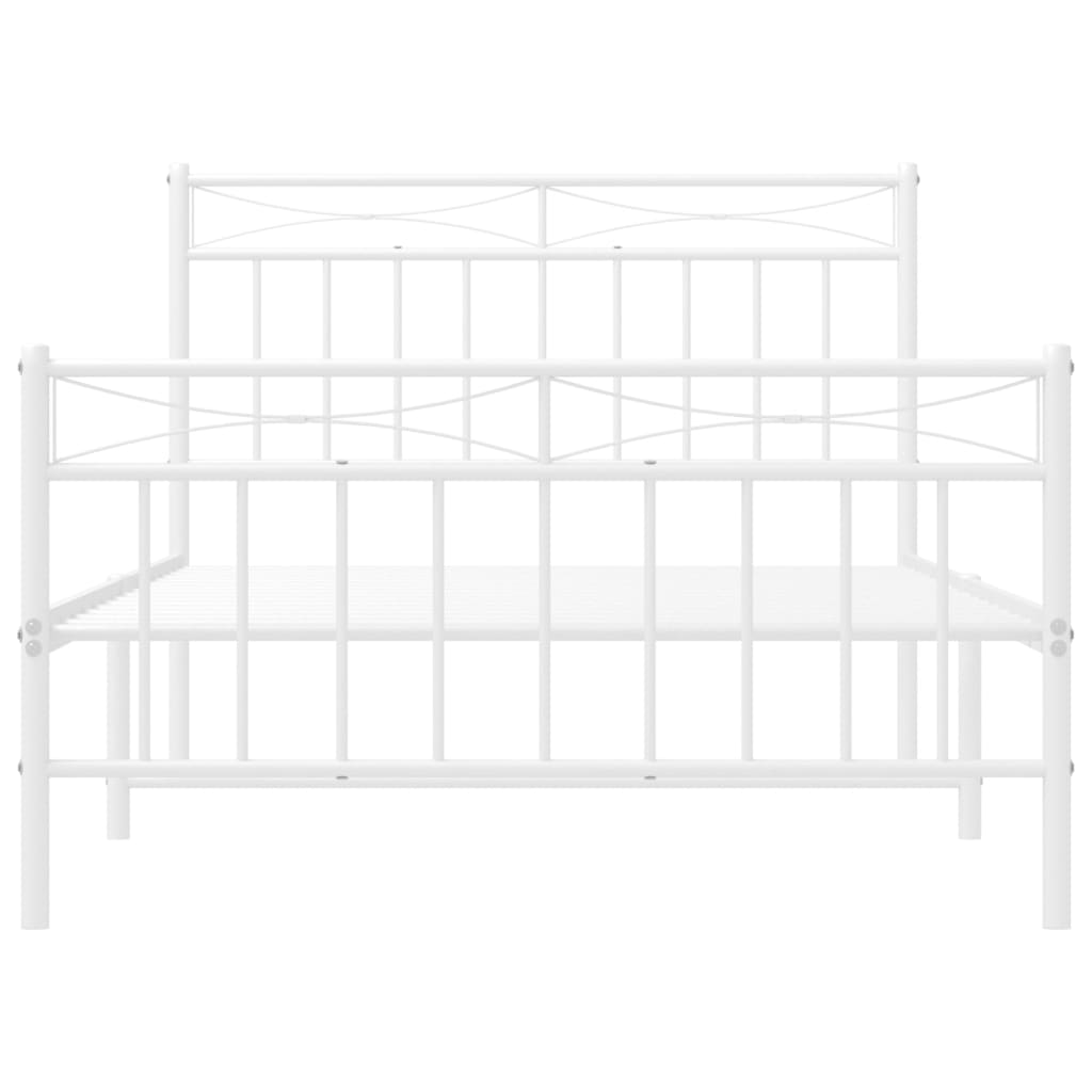 White metal bed frame with decorative headboard and footboard