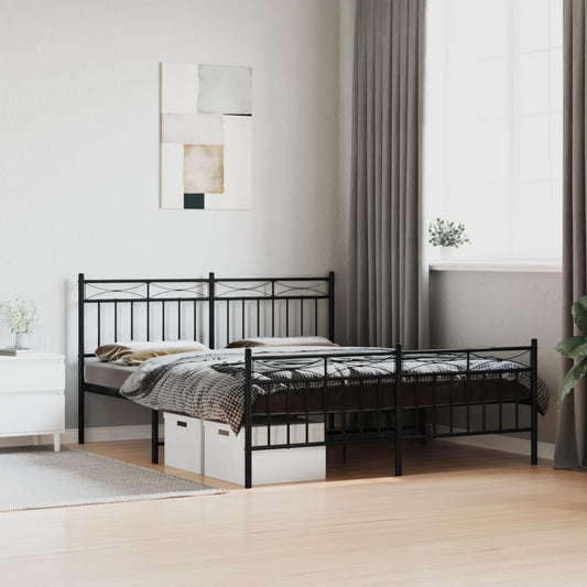 Black metal bed frame with ornate headboard and footboard featuring a patterned duvet and pillows