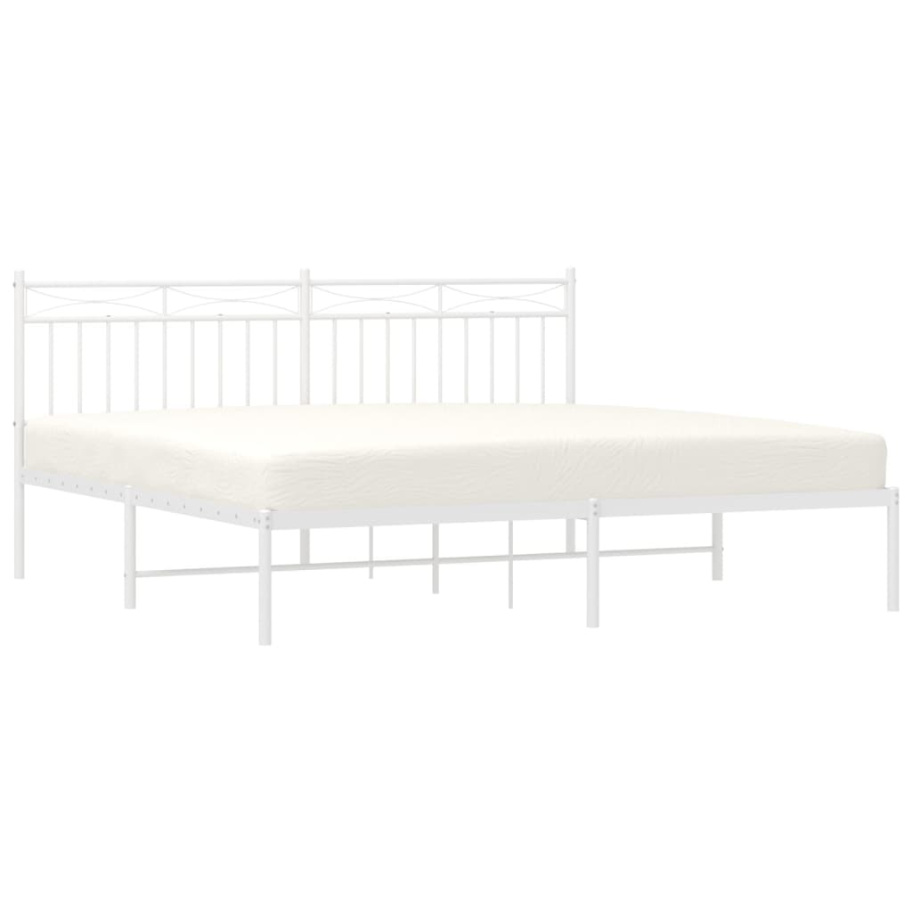 White metal bed frame with a mattress