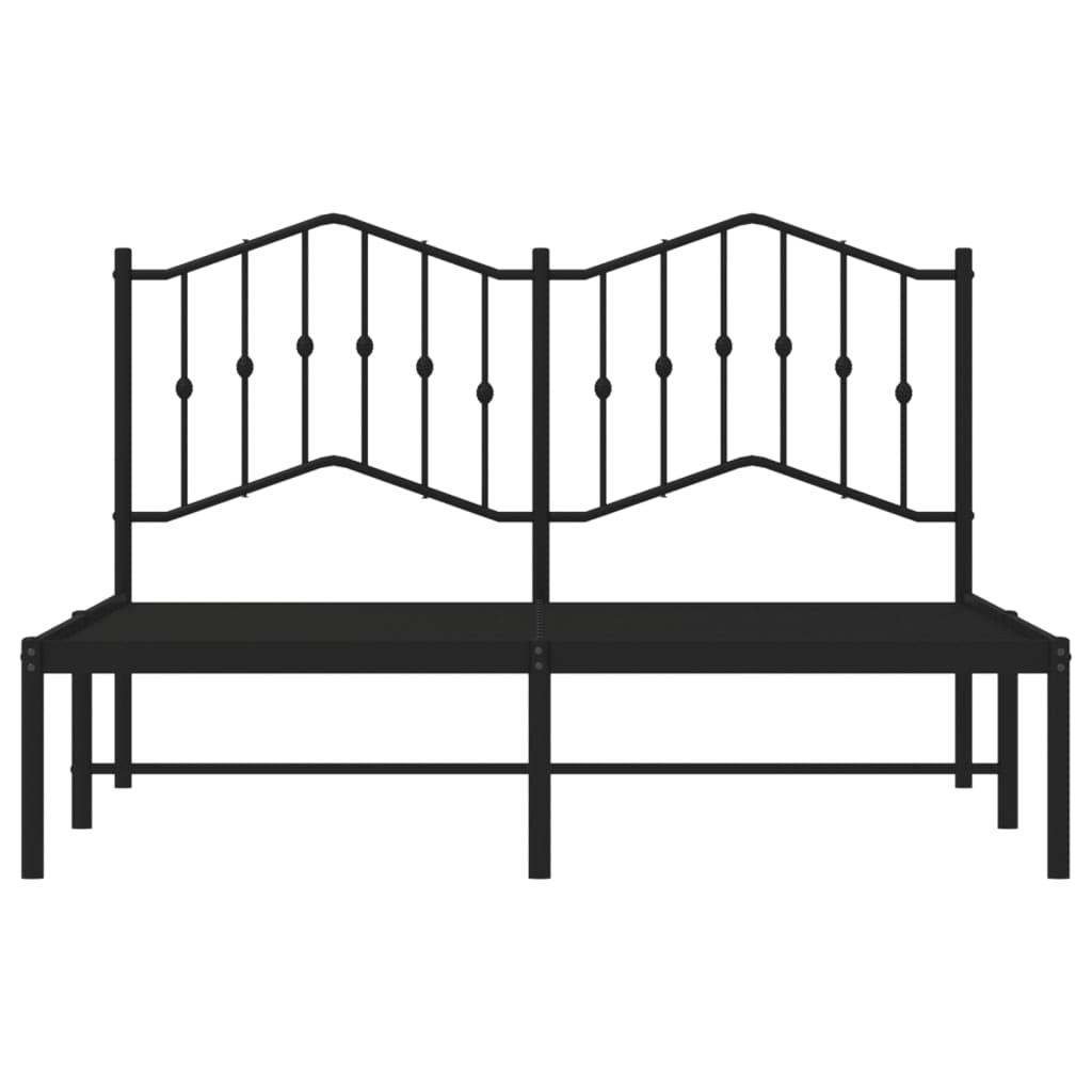 Black metal bed frame with decorative arched headboard and white mattress