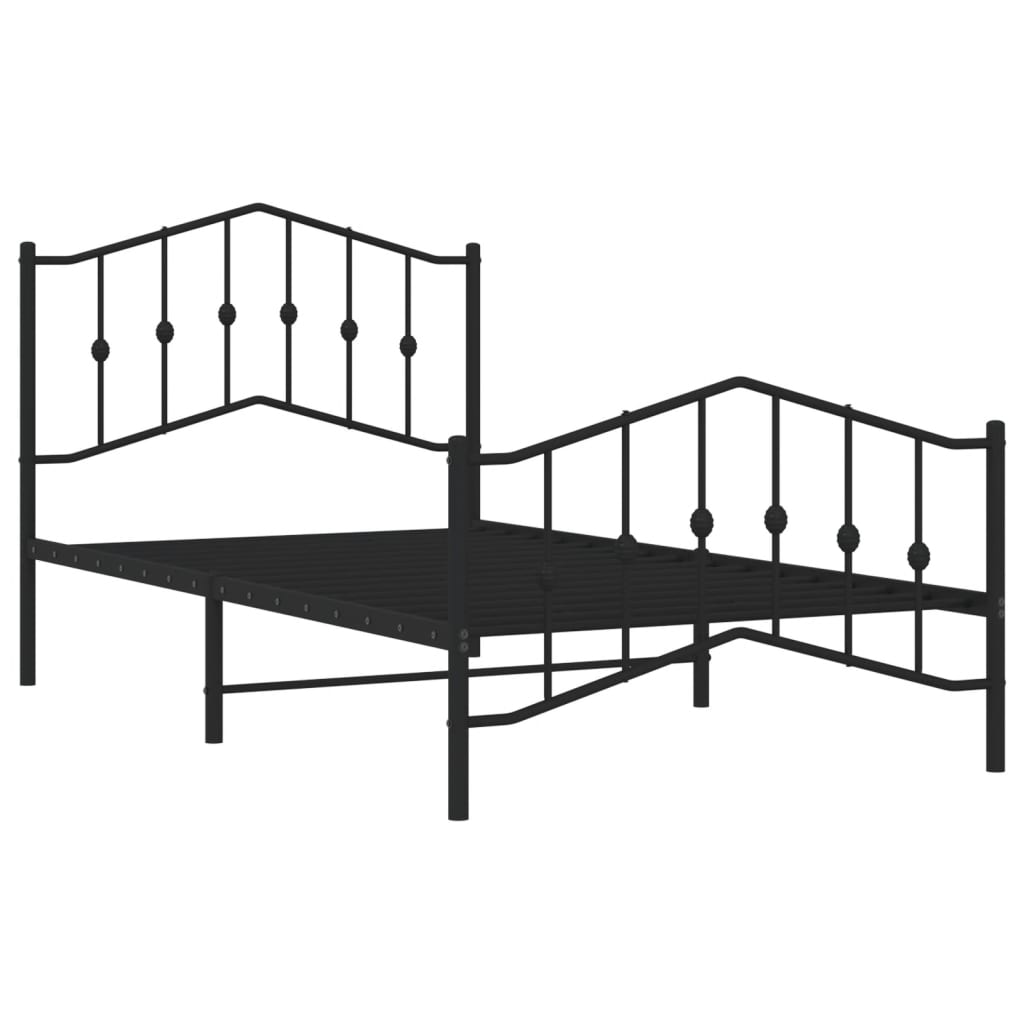 Dark gray metal bed frame with ornate headboard and footboard featuring decorative finials and a patterned comforter