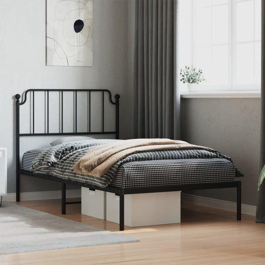 Black metal twin bed frame with ornate headboard and footboard