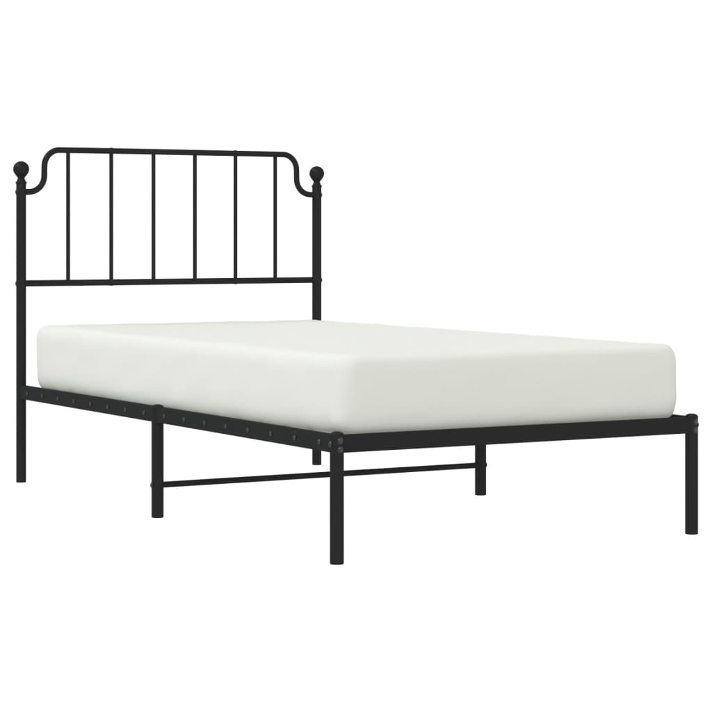 Black metal bed frame with a slatted headboard and white mattress