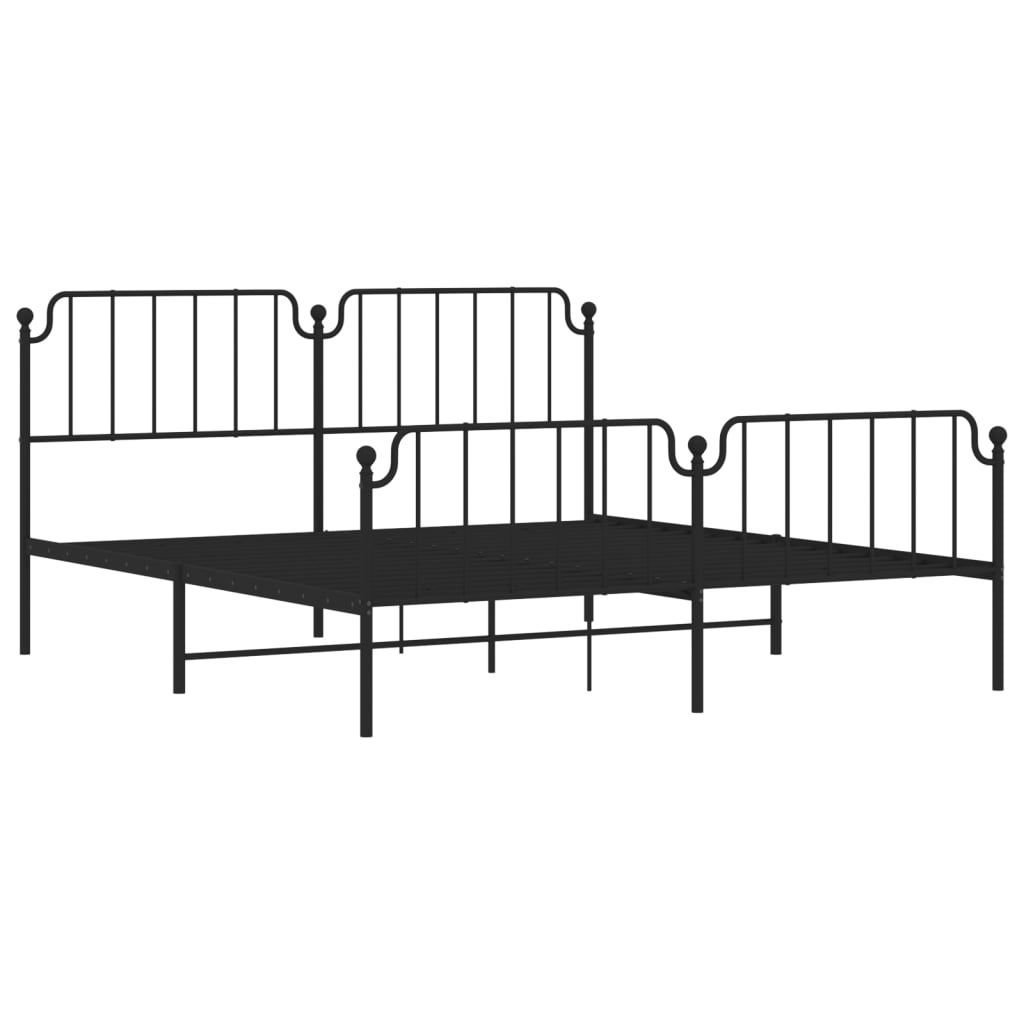 Dark metal twin bed frame with decorative finials and a black and white patterned duvet
