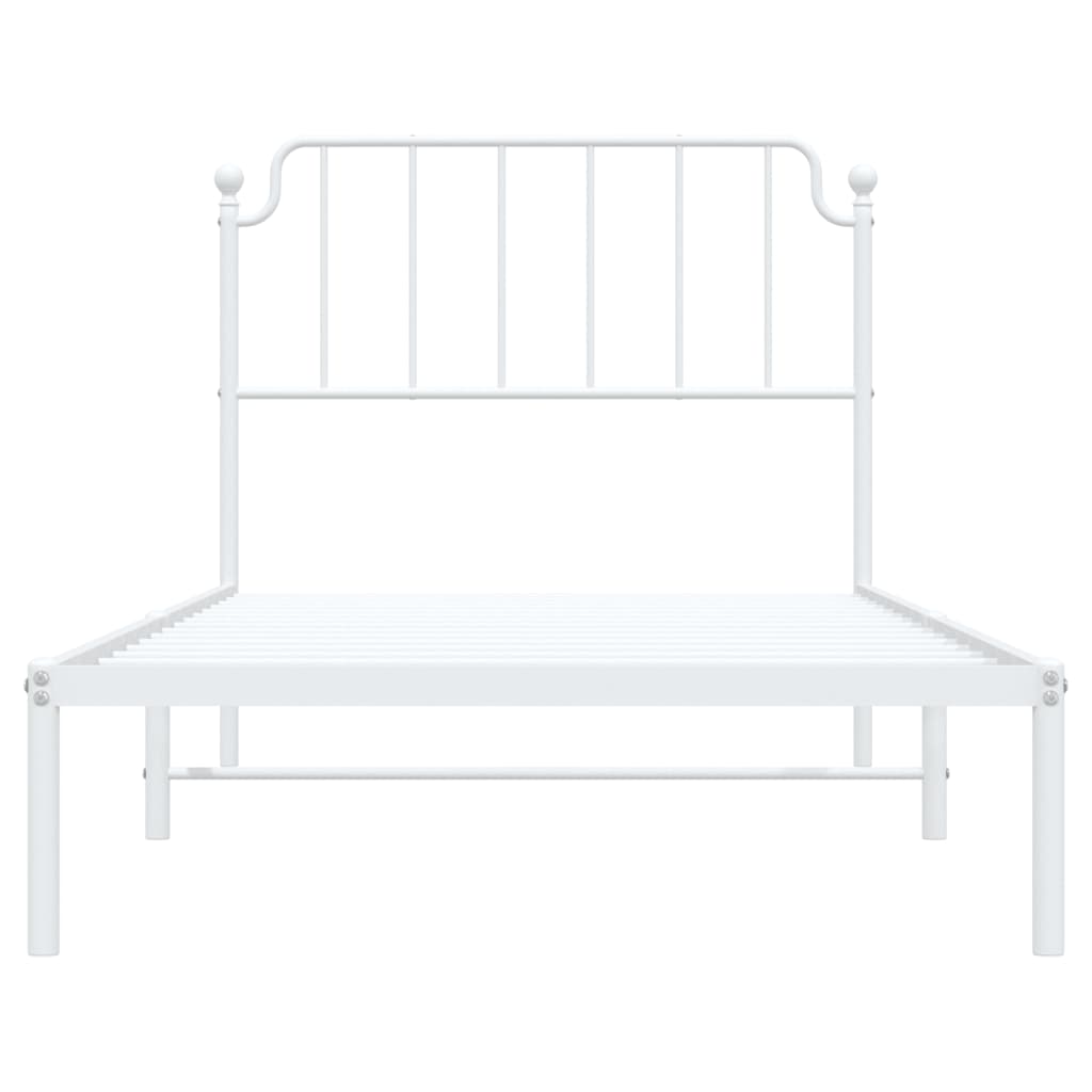 White metal twin bed frame with a simple slatted headboard and mattress
