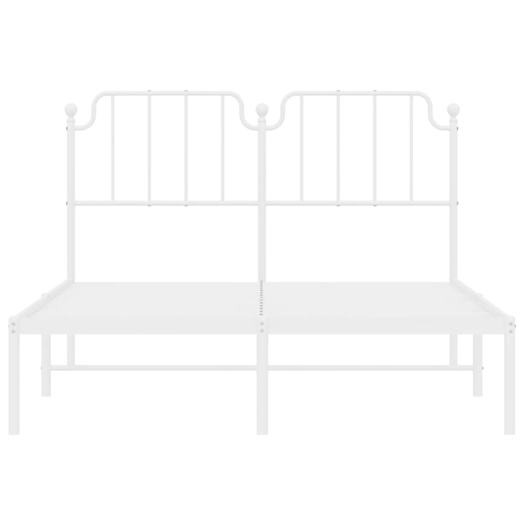 White metal bed frame with ornate headboard and mattress