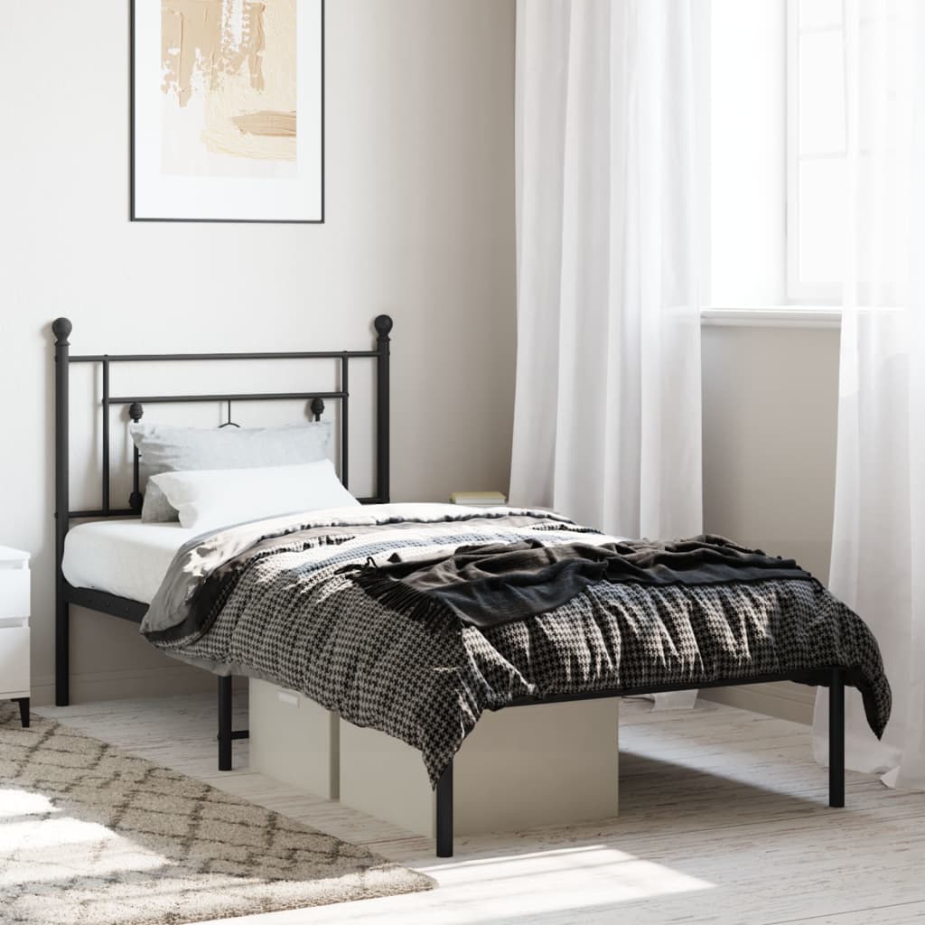 Black metal twin bed frame with ornate headboard suitable for modern bedrooms