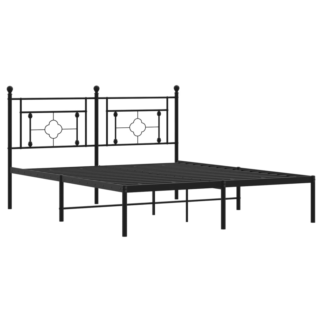 Black metal twin bed frame with ornate headboard and footboard
