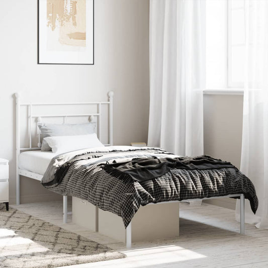 White metal twin bed frame with a decorative headboard and footboard