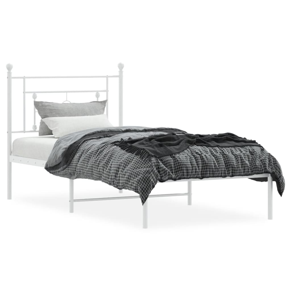 White metal twin bed frame with decorative headboard