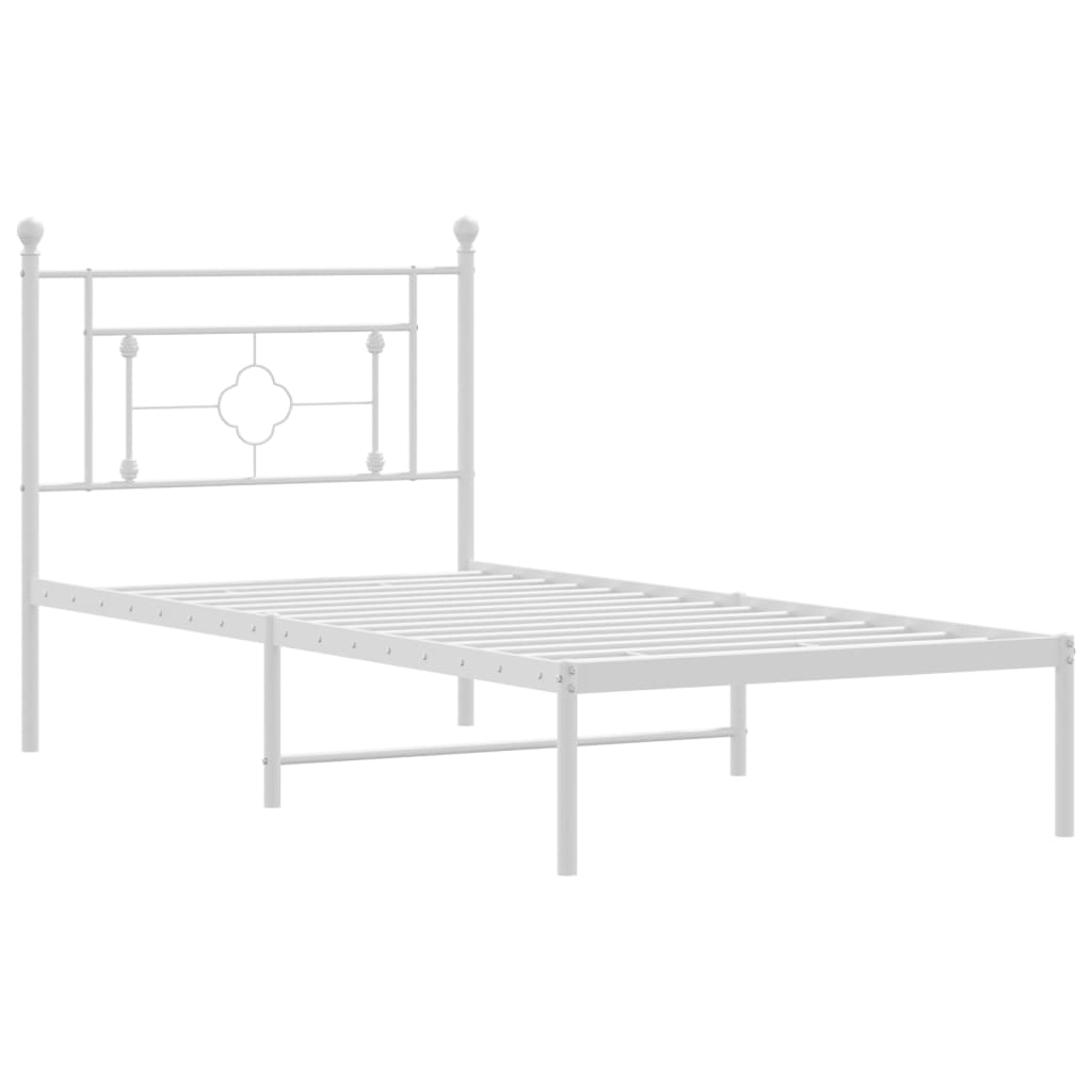 White metal twin bed frame with decorative headboard and footboard