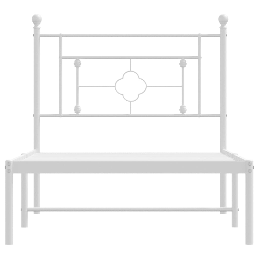 White metal twin bed frame with decorative headboard
