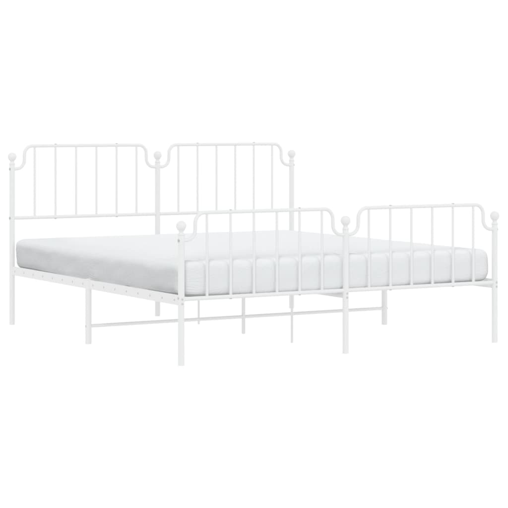 White metal bed frame with ornate detailing and mattress