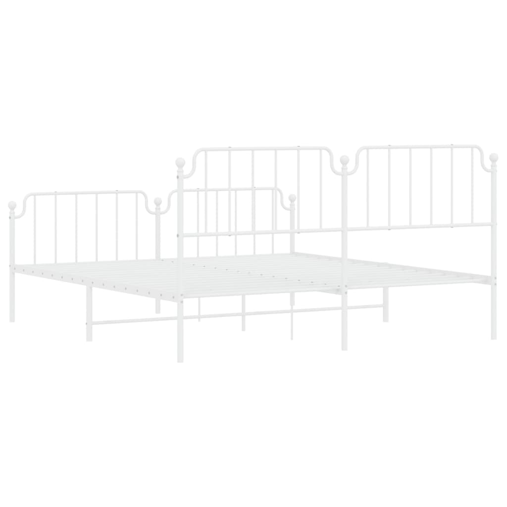 White metal daybed with ornate scrolling headboard and footboard
