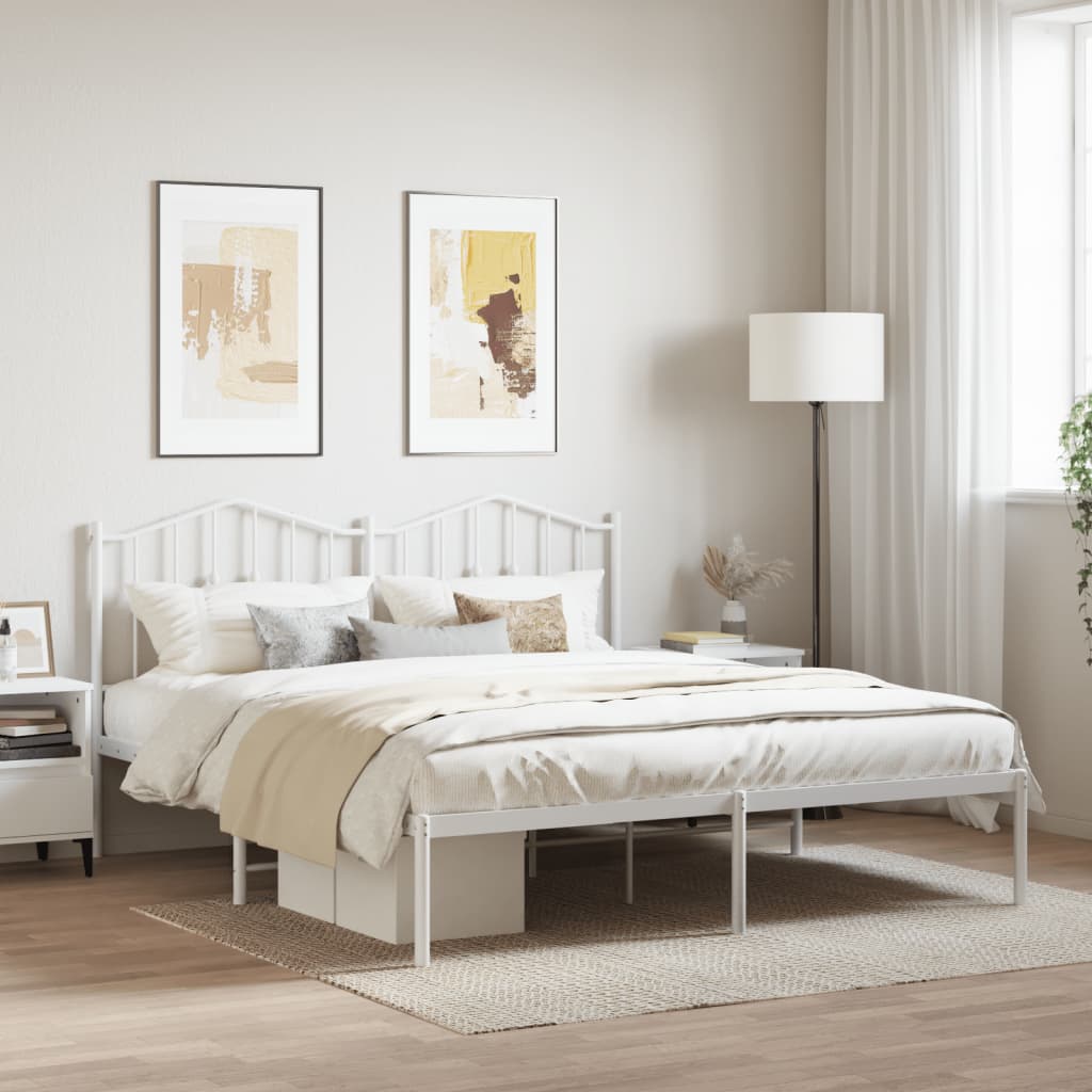 White metal bed frame with ornate headboard and footboard